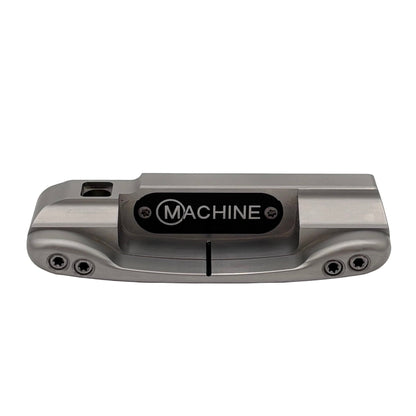 A gray putter head with the label 'MACHINE' on the top, featuring sight line in the cavity.
